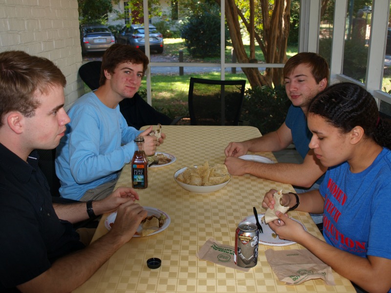 Mitchell, Aidan, Max and Marissa are enjoying the food from Moe's.